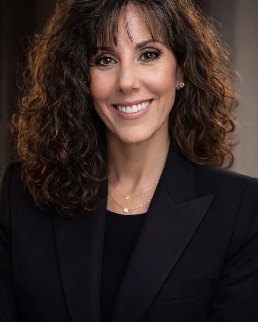 A brunette lady smiling